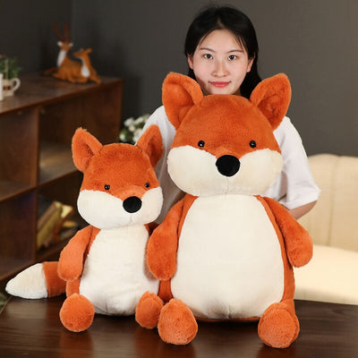 2 peluches renard roux avec femme